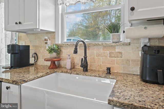16 Century Way, Hamilton, NJ 08690 - room details with backsplash, a sink, light stone counters, and white cabinetry