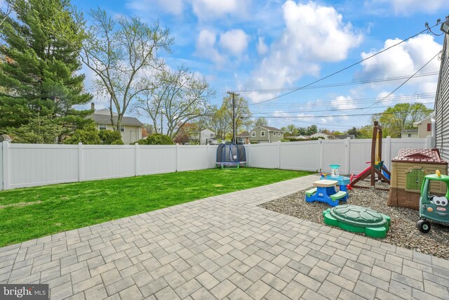 16 Century Way, Hamilton, NJ 08690 - view of patio / terrace featuring a trampoline, a playground, and a fenced backyard