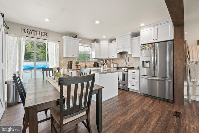 16 Century Way, Hamilton, NJ 08690 - kitchen featuring dark wood-type flooring, stainless steel appliances, decorative backsplash, and white cabinets