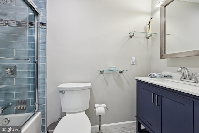 7112 Bonniemill Ln, Springfield, VA 22150 - bathroom with vanity, toilet, bath / shower combo with glass door, marble look tile flooring, and baseboards