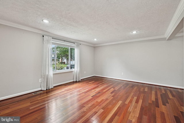 7112 Bonniemill Ln, Springfield, VA 22150 - empty room featuring a textured ceiling, ornamental molding, hardwood / wood-style flooring, baseboards, and recessed lighting