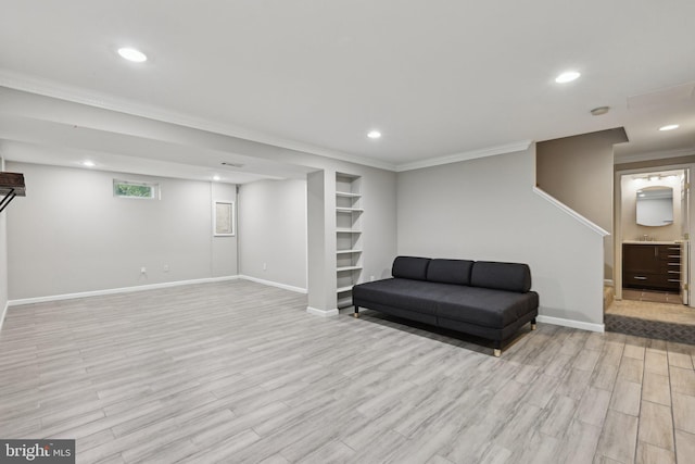 7112 Bonniemill Ln, Springfield, VA 22150 - sitting room with light wood-style flooring, ornamental molding, baseboards, recessed lighting, and built in shelves