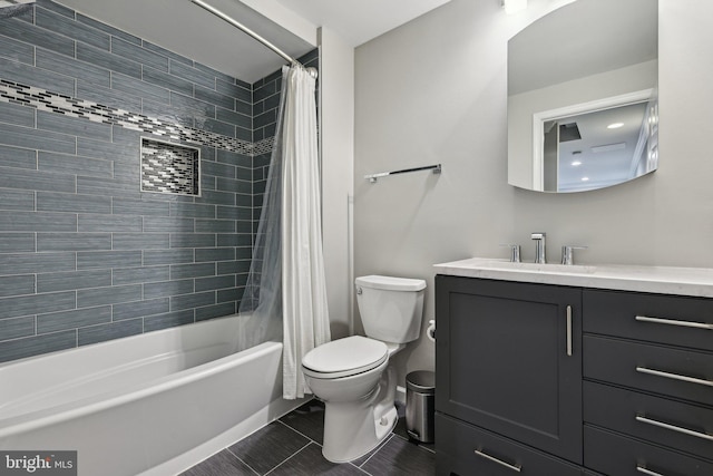 7112 Bonniemill Ln, Springfield, VA 22150 - bathroom featuring vanity, shower / bath combo with shower curtain, toilet, and tile patterned flooring