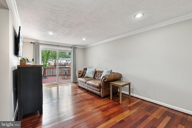 7112 Bonniemill Ln, Springfield, VA 22150 - living area featuring a textured ceiling, wood-type flooring, crown molding, baseboards, and recessed lighting