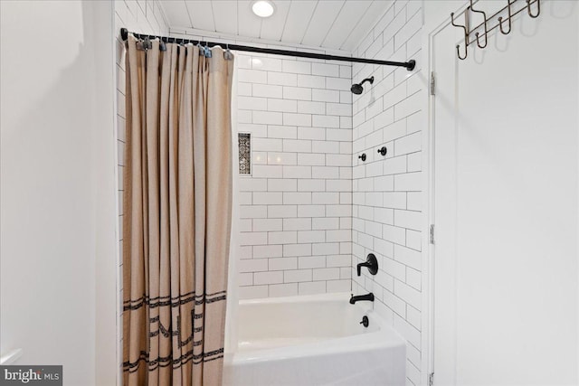 bathroom featuring shower / bathtub combination with curtain and recessed lighting