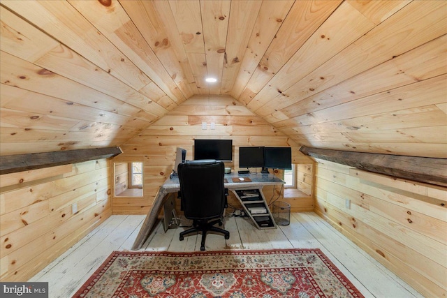 office space featuring wood walls, hardwood / wood-style floors, lofted ceiling, and wooden ceiling