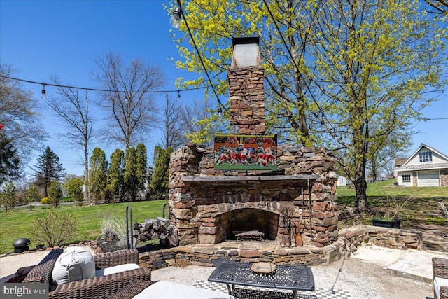 view of patio / terrace with an outdoor stone fireplace