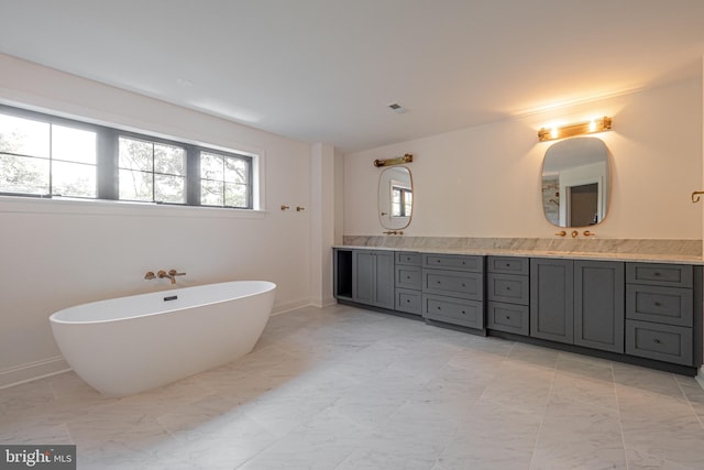 301 Reservoir Rd Lot A Front, Lot A Front, West Chester, PA 19380 - bathroom with a freestanding bath, double vanity, marble finish floor, baseboards, and visible vents