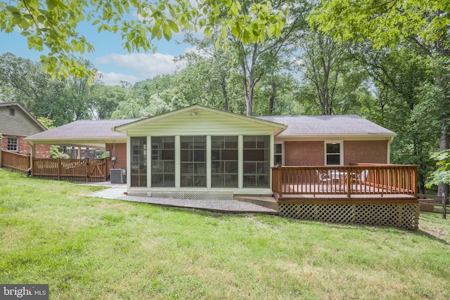 13709 Wendover Rd, Silver Spring, MD 20904 - back of property with brick siding, a sunroom, a deck, and a lawn