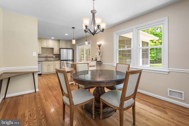 13709 Wendover Rd, Silver Spring, MD 20904 - dining area featuring a chandelier, baseboards, light wood-type flooring, plenty of natural light, and recessed lighting