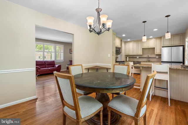 13709 Wendover Rd, Silver Spring, MD 20904 - dining space featuring a chandelier, light wood-style floors, baseboards, and recessed lighting