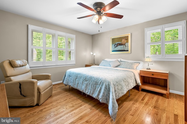 13709 Wendover Rd, Silver Spring, MD 20904 - bedroom with multiple windows, baseboards, and light wood-style floors