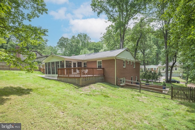 13709 Wendover Rd, Silver Spring, MD 20904 - rear view of house with a sunroom, brick siding, and a wooden deck