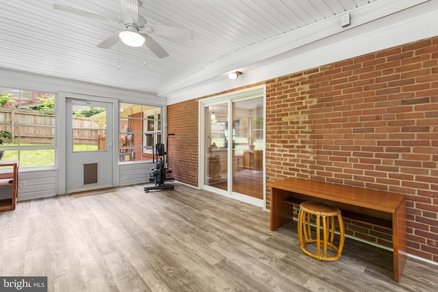 13709 Wendover Rd, Silver Spring, MD 20904 - unfurnished sunroom featuring a ceiling fan, brick wall, and wood finished floors
