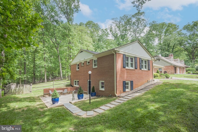 13709 Wendover Rd, Silver Spring, MD 20904 - view of side of home with a patio area and brick siding