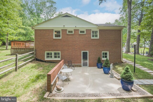 13709 Wendover Rd, Silver Spring, MD 20904 - rear view of property with brick siding, a wooden deck, and a patio