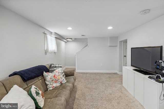 living room featuring light colored carpet, recessed lighting, and baseboards