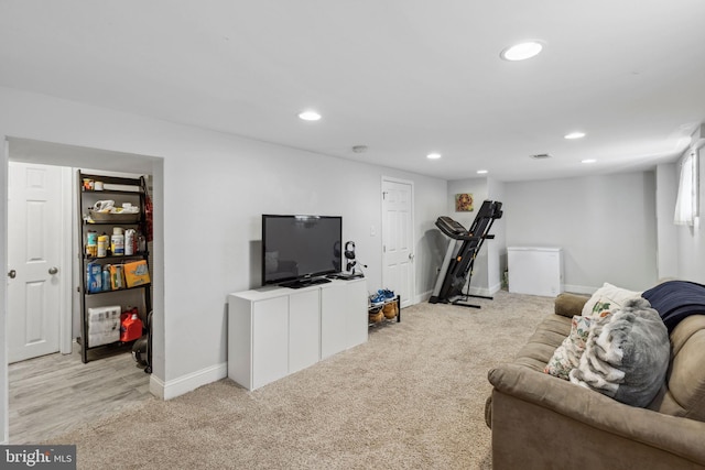 living room with light carpet, baseboards, and recessed lighting