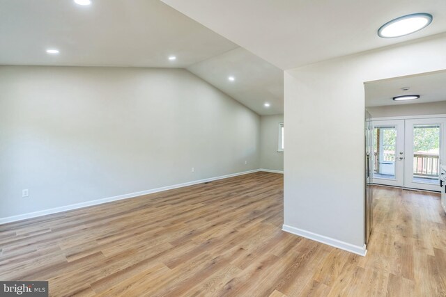 unfurnished room featuring recessed lighting, light wood-style flooring, and baseboards