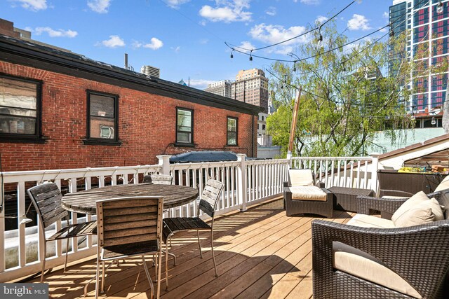 1207 Spruce St Unit 301, Philadelphia, PA 19107 - wooden deck featuring outdoor dining area