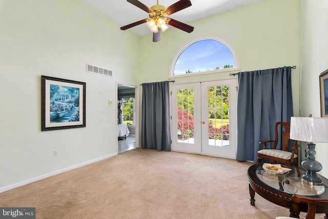 178 Cool Breeze Dr, Clayton, DE 19938 - living area featuring french doors, a towering ceiling, carpet, ceiling fan, and baseboards