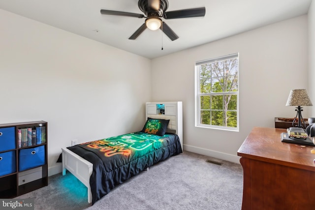 bedroom featuring visible vents, carpet flooring, baseboards, and ceiling fan