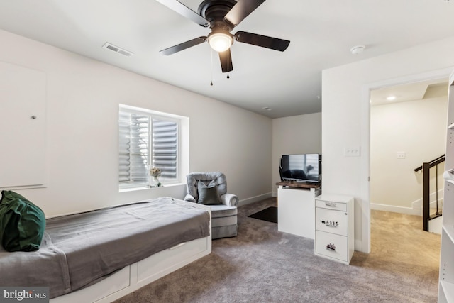 bedroom featuring light carpet, baseboards, visible vents, and ceiling fan