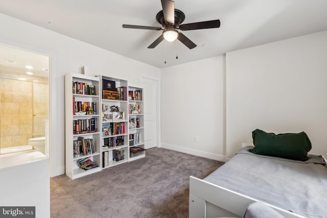 bedroom featuring baseboards, ensuite bath, a ceiling fan, and carpet