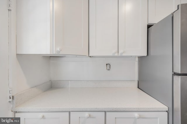 647 Emerson St NE, Washington, DC 20017 - interior details featuring freestanding refrigerator