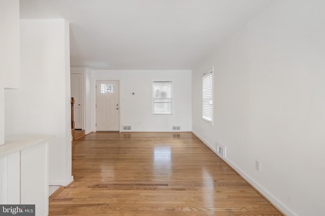 647 Emerson St NE, Washington, DC 20017 - foyer with baseboards, light wood-style flooring, and visible vents