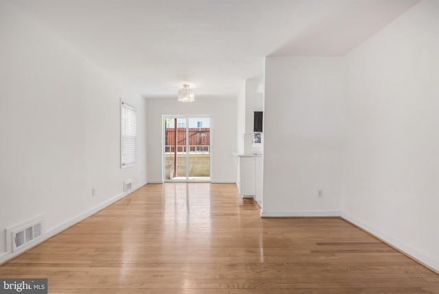 647 Emerson St NE, Washington, DC 20017 - unfurnished room featuring light wood-style floors, visible vents, and baseboards