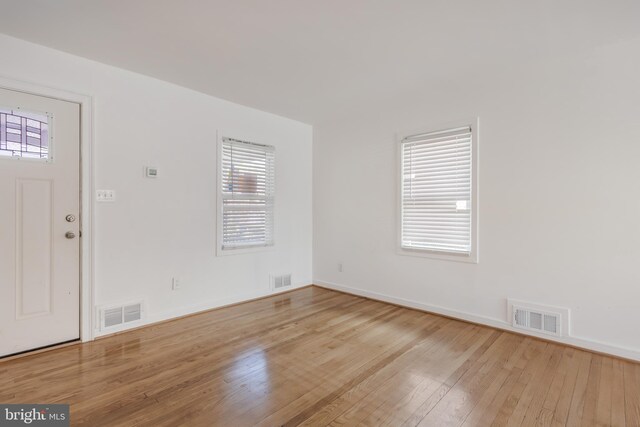 647 Emerson St NE, Washington, DC 20017 - foyer featuring a wealth of natural light, hardwood / wood-style floors, and visible vents