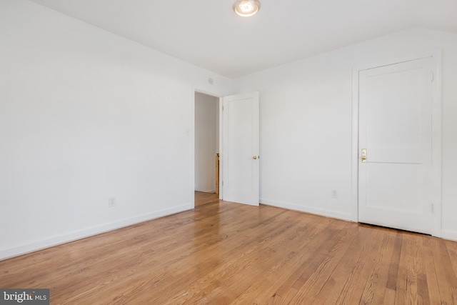 647 Emerson St NE, Washington, DC 20017 - unfurnished bedroom with baseboards and light wood-style floors