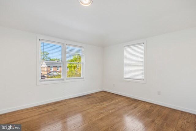 647 Emerson St NE, Washington, DC 20017 - empty room with baseboards and wood finished floors