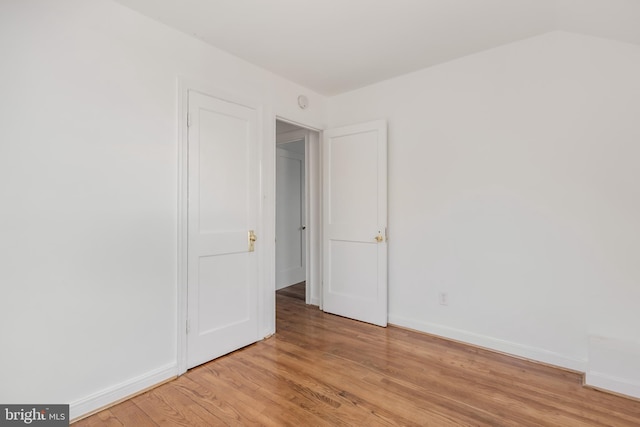 647 Emerson St NE, Washington, DC 20017 - unfurnished bedroom featuring light wood-style floors and baseboards