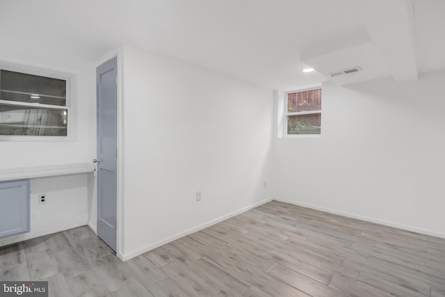 647 Emerson St NE, Washington, DC 20017 - spare room featuring visible vents, light wood finished floors, and baseboards