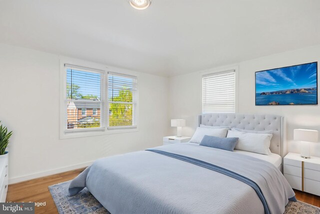 647 Emerson St NE, Washington, DC 20017 - bedroom featuring baseboards and wood finished floors