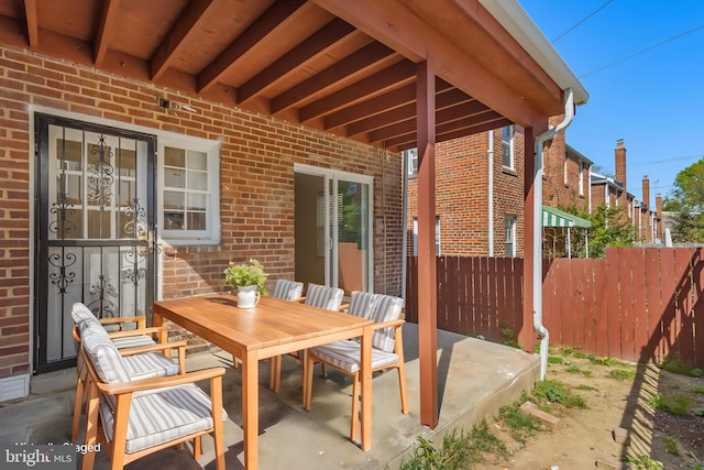 647 Emerson St NE, Washington, DC 20017 - view of patio with outdoor dining area and fence
