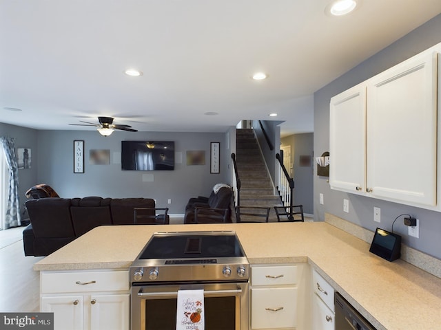 10037 Grapevine Rd, Mardela Springs, MD 21837 - kitchen with stainless steel range with electric cooktop, open floor plan, light countertops, a ceiling fan, and white cabinets