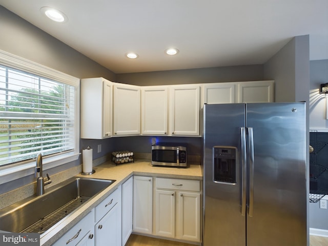 10037 Grapevine Rd, Mardela Springs, MD 21837 - kitchen featuring appliances with stainless steel finishes, a sink, white cabinets, light countertops, and recessed lighting