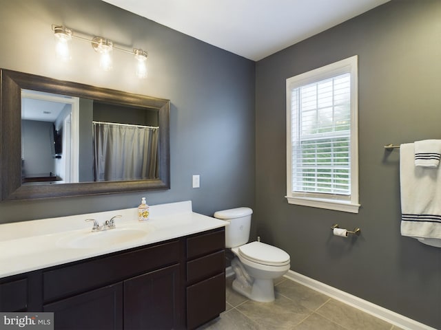 10037 Grapevine Rd, Mardela Springs, MD 21837 - bathroom featuring healthy amount of natural light, toilet, vanity, and baseboards