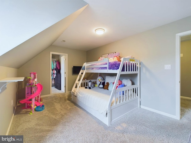 10037 Grapevine Rd, Mardela Springs, MD 21837 - carpeted bedroom featuring a walk in closet, vaulted ceiling, and baseboards