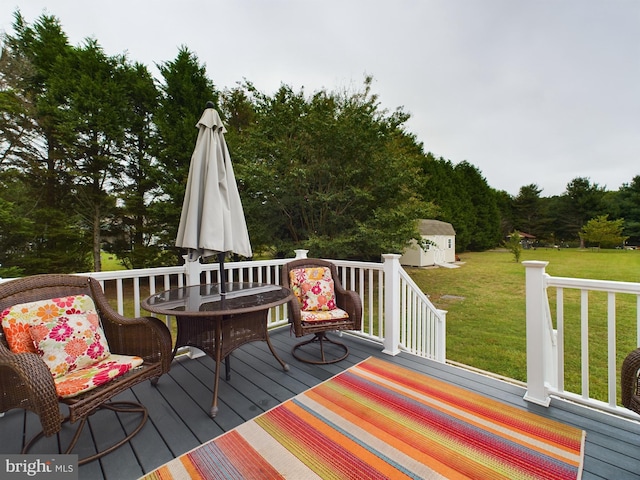 10037 Grapevine Rd, Mardela Springs, MD 21837 - deck featuring an outdoor structure, a shed, and a lawn