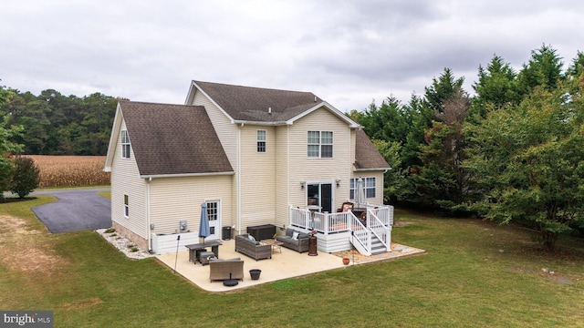 10037 Grapevine Rd, Mardela Springs, MD 21837 - rear view of house featuring an outdoor living space, a patio area, a lawn, and a deck