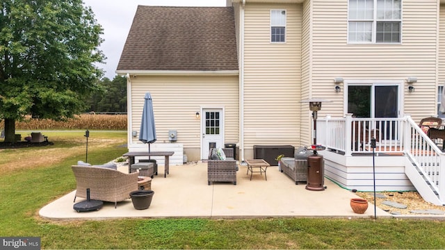 10037 Grapevine Rd, Mardela Springs, MD 21837 - back of property featuring a yard, a patio, an outdoor hangout area, and roof with shingles