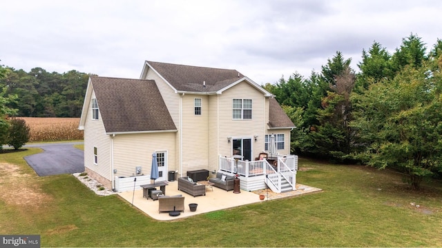 10037 Grapevine Rd, Mardela Springs, MD 21837 - back of property with an outdoor living space, a patio, a yard, and a deck