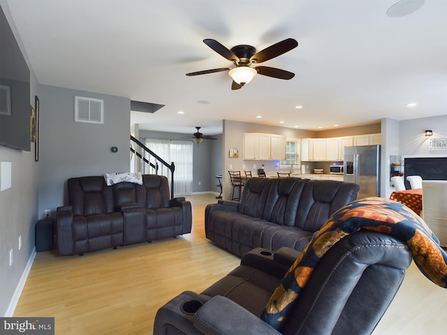 10037 Grapevine Rd, Mardela Springs, MD 21837 - living room featuring a ceiling fan, light wood-style floors, baseboards, stairs, and recessed lighting