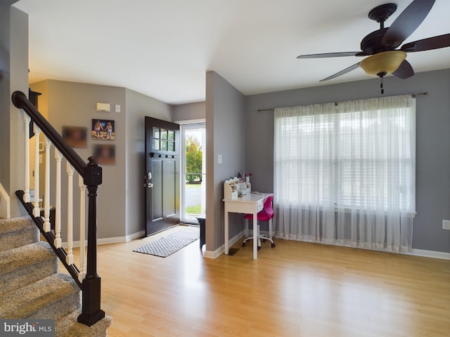 10037 Grapevine Rd, Mardela Springs, MD 21837 - foyer entrance featuring wood finished floors, ceiling fan, stairs, and baseboards