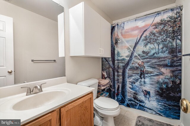 full bathroom featuring vanity, toilet, tile patterned flooring, and a shower with shower curtain