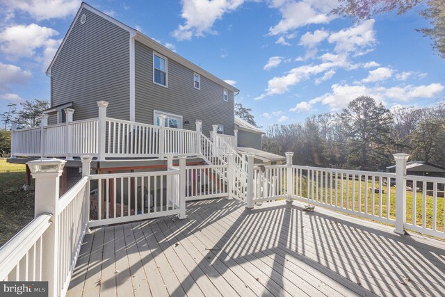 wooden deck featuring stairs
